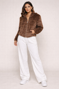 Unleash your boldest self in this statement-making zip-up fur jacket. 